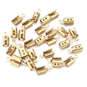 Macro view of gold-plated stainless steel crimp cord ends for DIY jewelry making