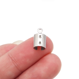 Detail of a small stainless steel cylinder crimp end cap for handmade jewelry making