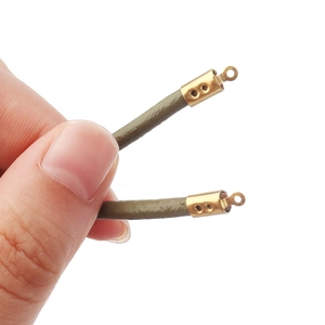 Handheld view of olive green leather cord with gold stainless steel jewelry end caps