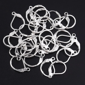 Close-up of silver lever-back earring hooks with spring closure for DIY jewelry making
