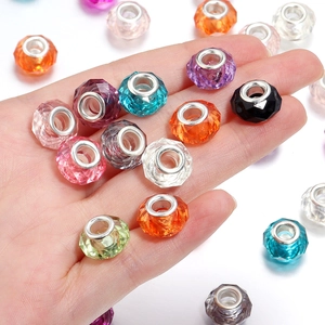 Close-up of colorful faceted resin beads with silver metal cores for DIY jewelry making
