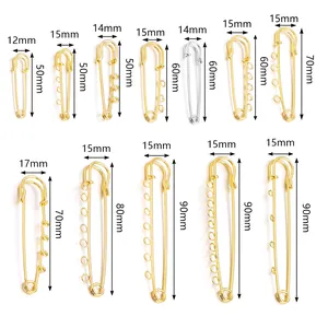 Varios tamaños de imperdibles dorados y plateados con bucles para joyería DIY