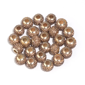 Macro shot of champagne crystal beads for DIY jewelry with gold metal base