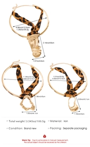 Detailed view of leopard print ribbon choker necklaces with abstract golden pendants