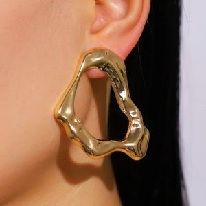 Exaggerated irregular geometric gold stud earrings for women in liquid metal style