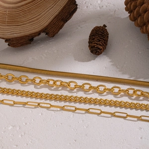 Close-up of four 18K gold plated stainless steel necklace chains in various classic styles