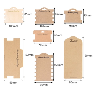 Various sizes of kraft and off-white jewelry display cards with holes and hanging slots