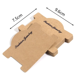 Macro detail of kraft paper jewelry display cards with dimensions 7.5cm by 9.6cm