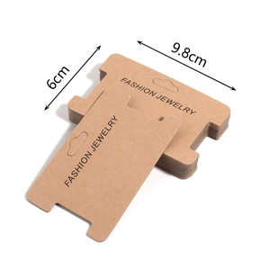 Macro view of kraft paper jewelry display cards for necklaces and hair accessories
