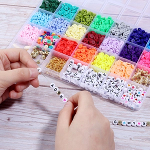 Close-up of DIY jewelry making kit with colorful clay beads and letter beads on a desk