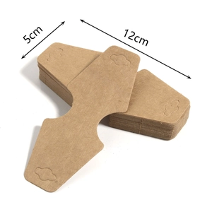 Macro detail of brown kraft paper jewelry display cards with 5cm and 12cm dimensions