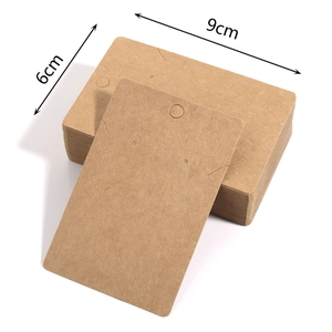 Macro shot showing 9cm by 6cm kraft paper jewelry display cards with hanging holes