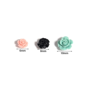 Three sizes of 3D camellia flower resin beads in pink, black, and mint green