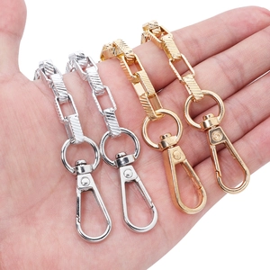 Detail of square link chains in gold and silver finish with swivel lobster clasps