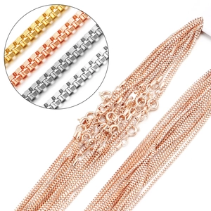 Detailed macro view of gold, rose gold and silver box chains with spring ring clasps