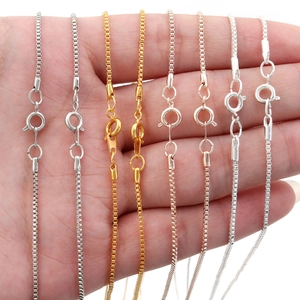 Detail of copper box chains in silver, gold, and rose gold with spring ring clasps