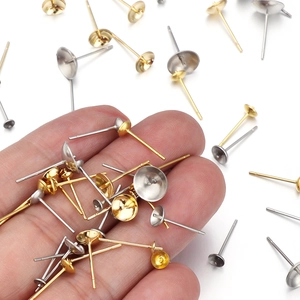 Macro shot of gold and silver stainless steel stud earring posts for DIY jewelry making