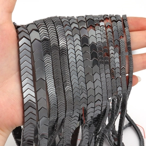 Macro detail of dark grey hematite chevron beads in various sizes for DIY jewelry making