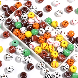 Close-up of assorted wooden sports beads for DIY jewelry including basketball and baseball