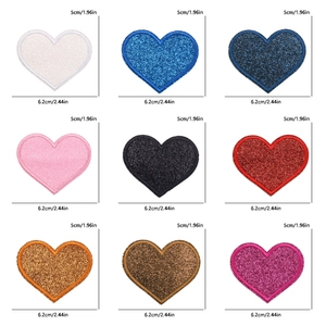 Detailed grid of 9 glitter heart embroidery patches in various colors with measurements