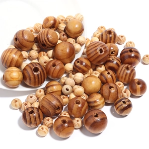 Natural round pine wood beads with zebra stripes for DIY craft and jewelry making