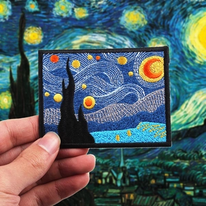 Macro detail of Van Gogh Starry Night embroidered patch with high density needlework