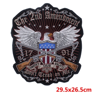 Macro detail of embroidered 2nd Amendment patch with eagle and rifles 29.5x26.5cm