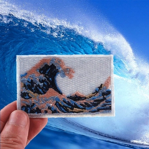 Embroidered Great Wave off Kanagawa patch with premium stitching on ocean background