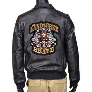 Detailed embroidery patch with eagle and skull on the back of a black leather biker jacket