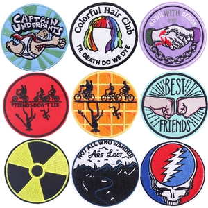 Set of decorative circular embroidered iron-on patches for clothing and DIY crafts.