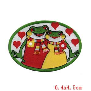 Macro detail of cartoon frog couple embroidery patch showing fine stitching and 6.4x4.5cm size