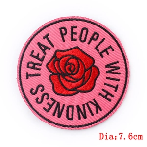 Pink circular embroidered rose patch with Treat People With Kindness slogan 7.6cm