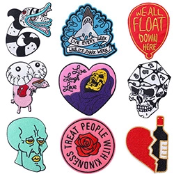 Macro view of 9pcs cartoon embroidery patches showing fine thread texture and vivid colors