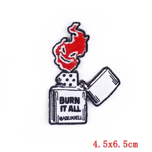 Detailed embroidery patch featuring a red flame over lighter with Burn It All text