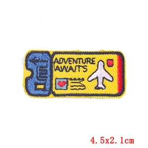 Adventure Awaits embroidered patch travel ticket design 4.5x2.1cm on white background