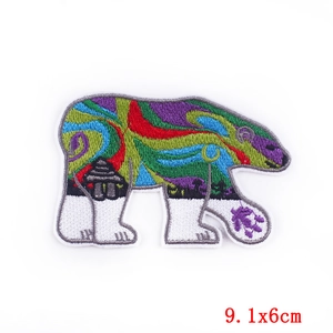Artistic polar bear embroidery patch with aurora pattern and inukshuk detail, 9.1x6cm size