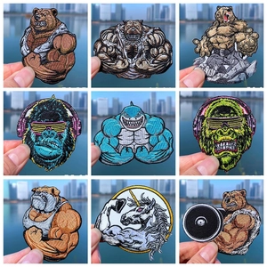 Detailed embroidery texture of nine muscle animal patches on denim fabric clothing
