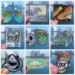 Macro detail of nine unique embroidered patches with nature and surrealist designs