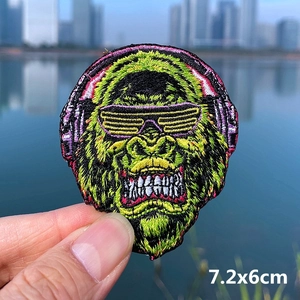Detail shot of gorilla embroidery patch with headphones, size 7.2x6cm for DIY clothing