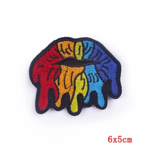 Detail of 6x5cm rainbow dripping lips embroidery patch with sharp stitching and black borders