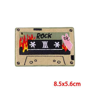 Detailed macro view of the rock cassette embroidered patch showing fine stitching and colors