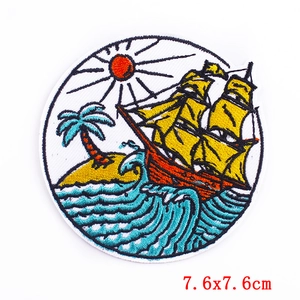Embroidered iron-on patch featuring a sailing ship with waves and sun, 7.6x7.6cm