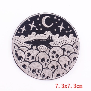 Detail of 7.3cm round embroidered patch with cat moon and skull gothic design