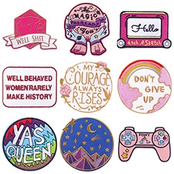 Detailed embroidery patch set with cartoon unicorn, rainbow clouds, and D20 dice motifs