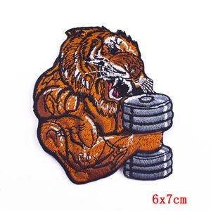 Detail of muscle tiger embroidery patch with dumbbell training design for DIY projects