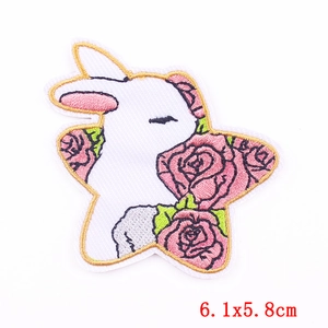 Cartoon white rabbit with pink flowers embroidered iron-on patch, size 6.1x5.8cm