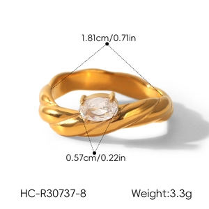 Detailed view of twisted gold stainless steel ring with zirconia, including dimensions.
