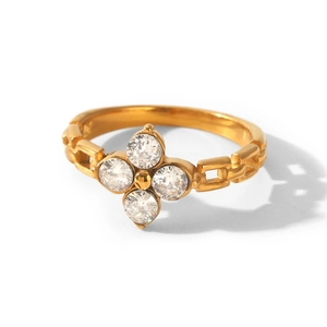 Close-up detail of a gold-plated titanium steel ring with a four-leaf clover zircon design