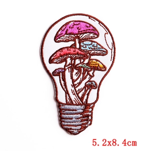 Macro detail of mushroom light bulb embroidered patch showing stitching and 5.2x8.4cm size