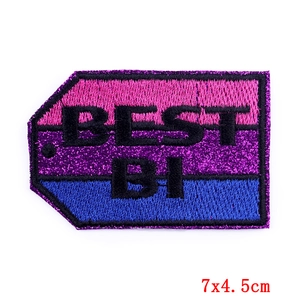 Detailed view of the BEST BI embroidered patch with pink and blue glitter, 7x4.5cm size